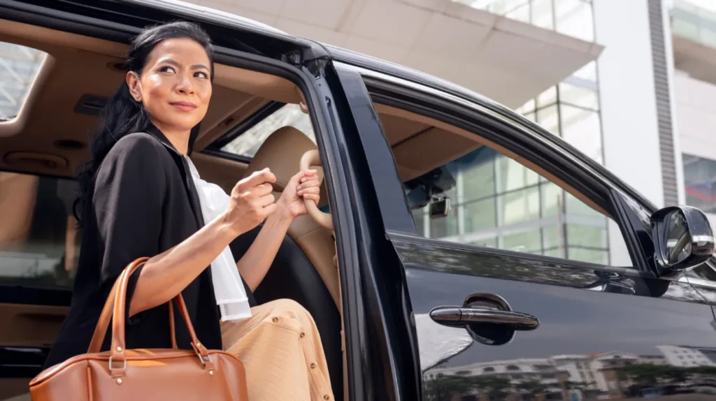 Happy female client enjoying occasion transport service from A Star Limousine